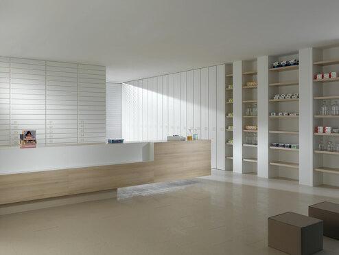 Impressionen einer Apothekeneinrichtung Impressionen einer Apothekeneinrichtung mit hellen Holzmöbeln und geräumigem Regalsystem, sowie aufgeräumten Empfang.