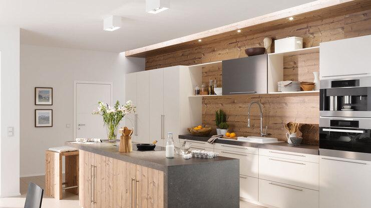 Impressionen eines Küchenstudios Impressionen einer Küche mit Esszimmer mit hellen Holzmöbeln und dunklen und weißen Fronten im Kontrast